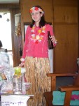 Suzanne trying on the grass skirt.